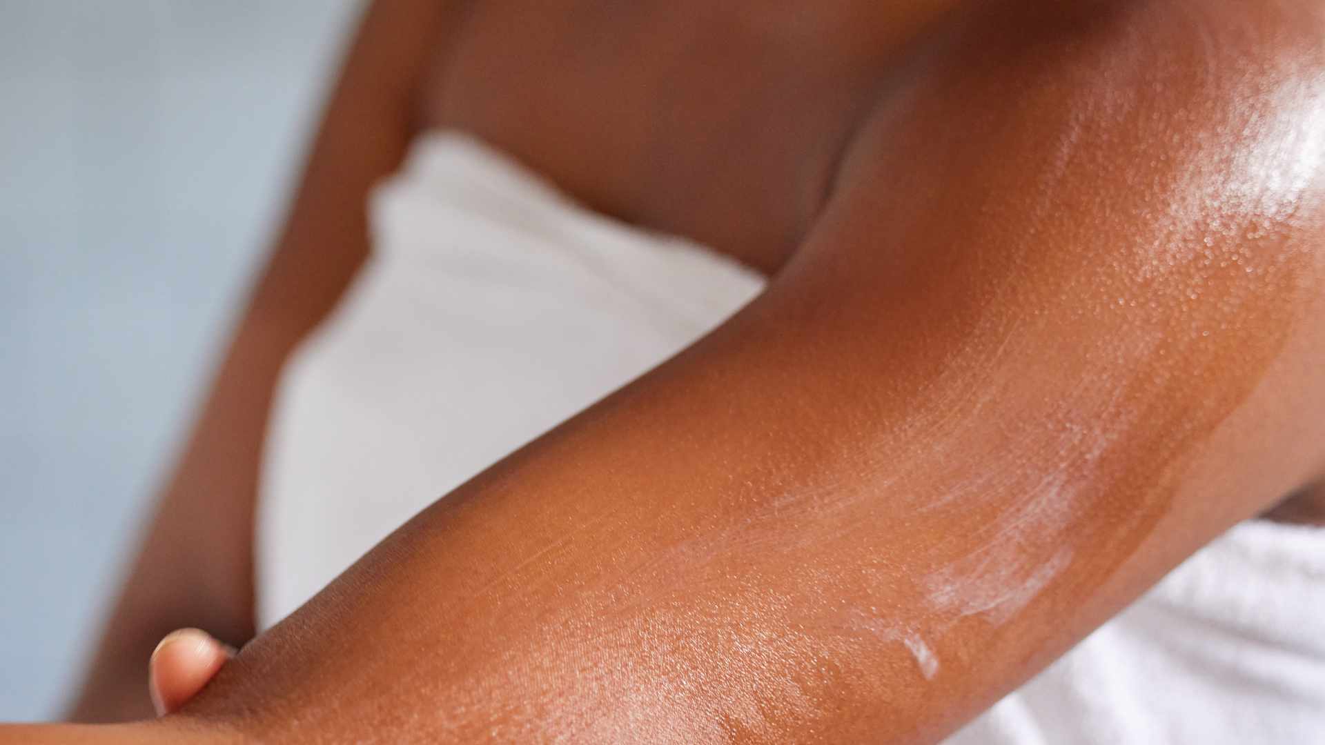 Moisturiser on arm, hydrated skin.