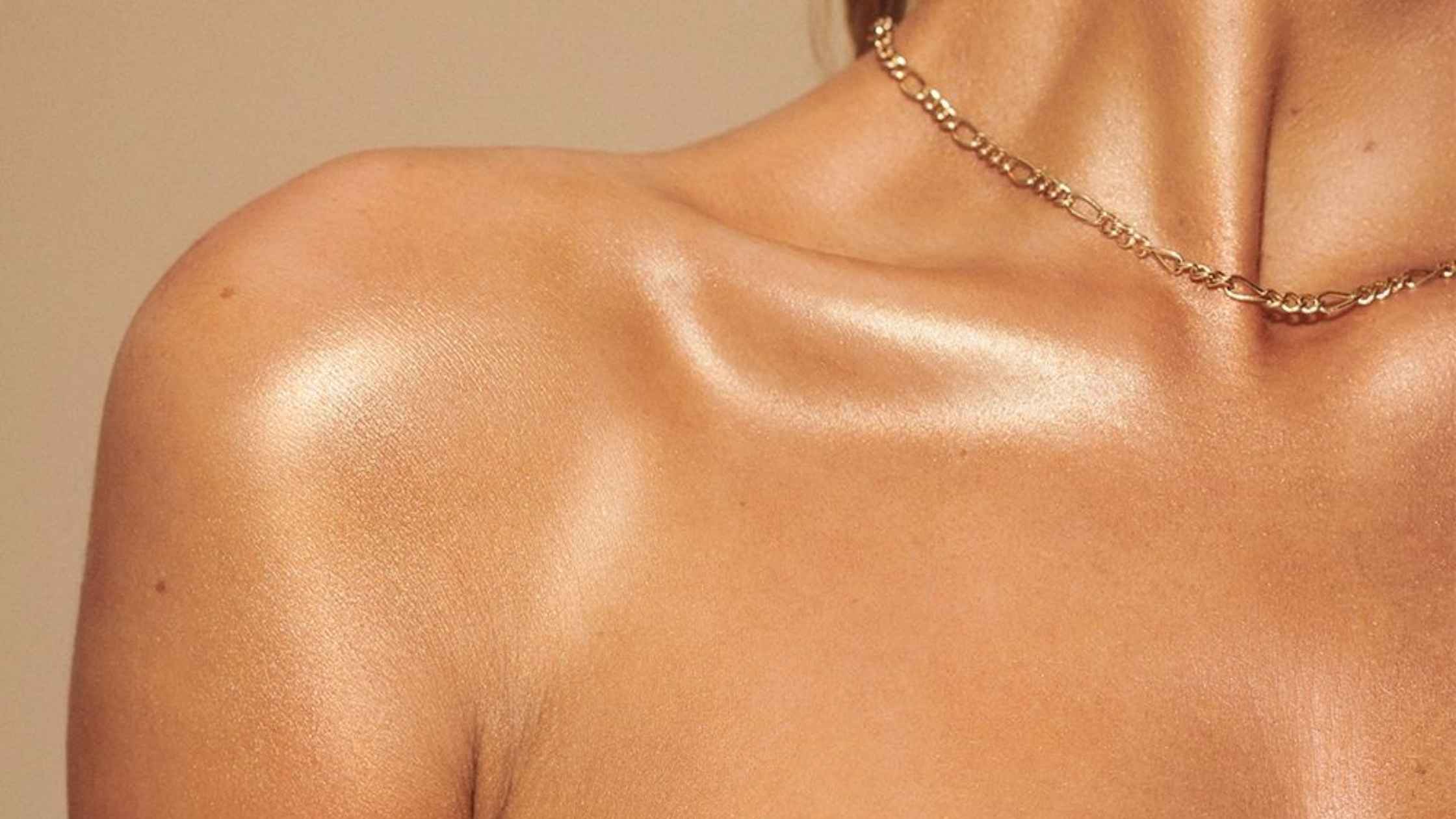A close up of a woman's tanned chest and shoulder from a Beauty Secret's Spa spray tan