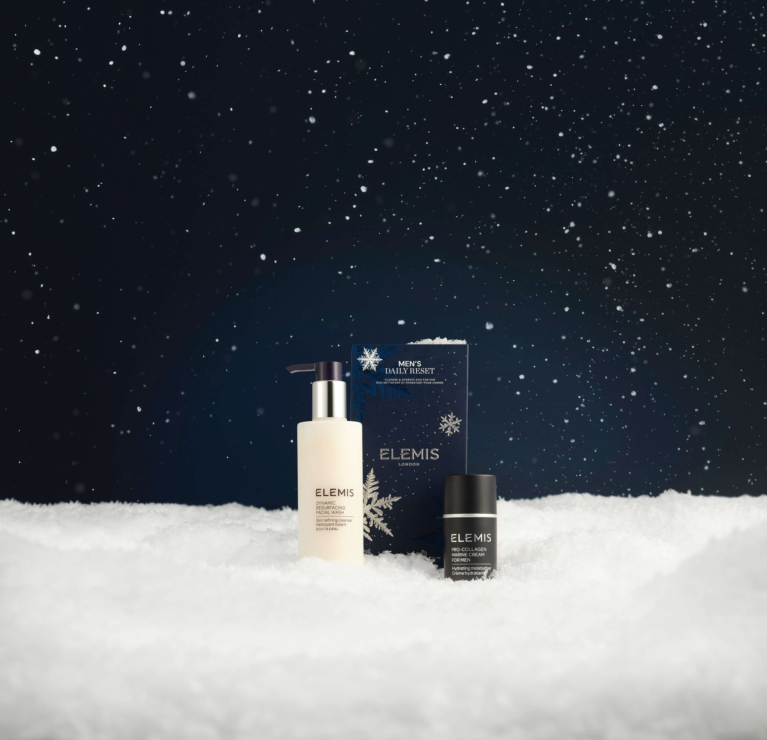 Elemis skincare products on a snowy landscape with a dark starry sky.