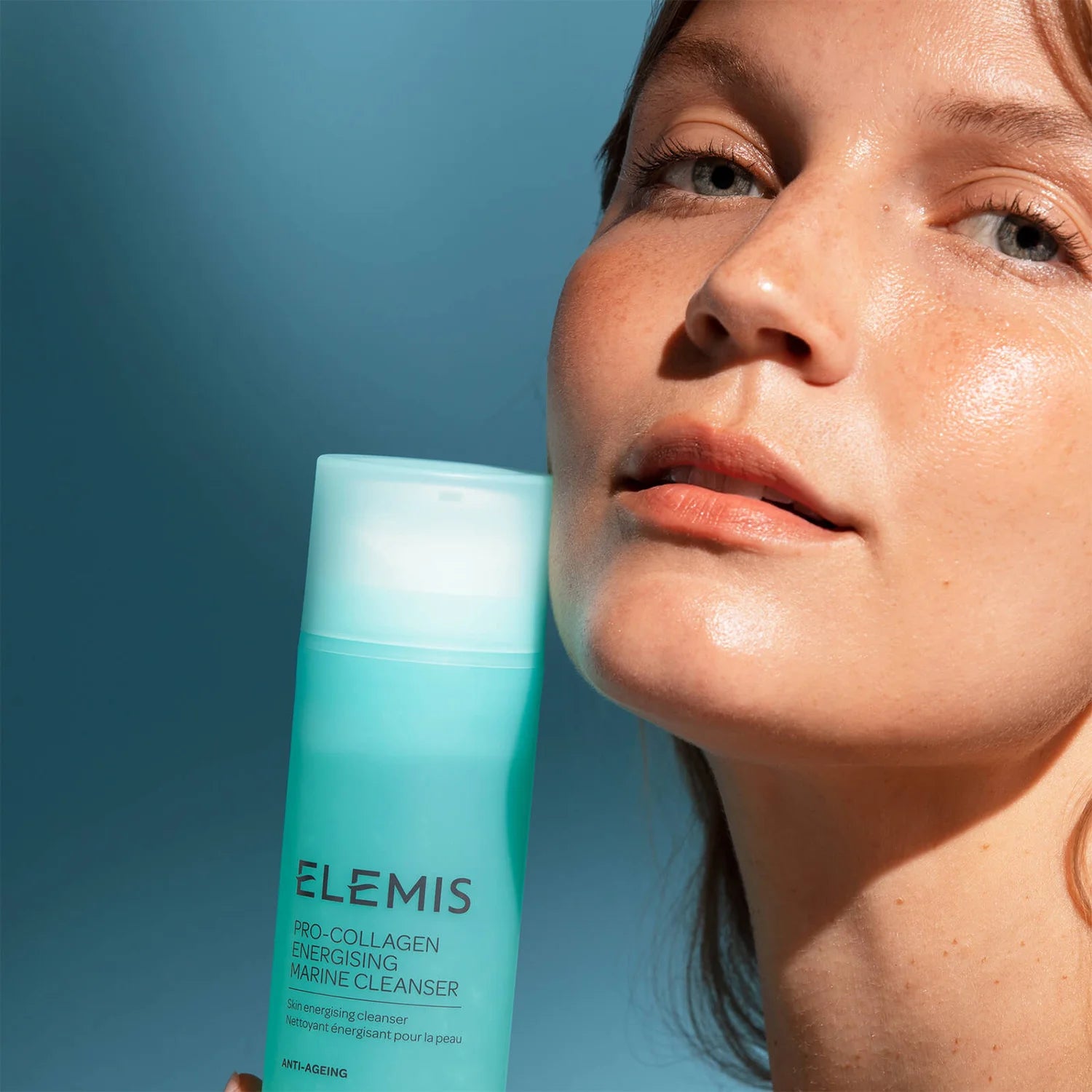 ELEMIS Pro-Collagen Energising Marine Cleanser with model that has glowing skin. 