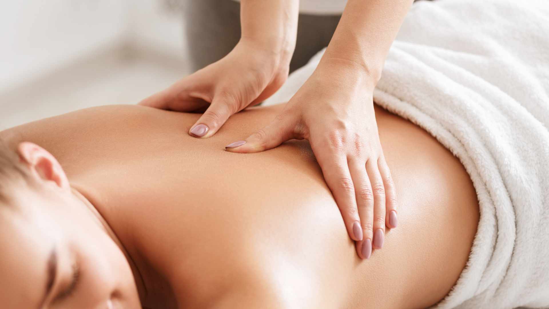 Deep tissue massage performed by therapist. 