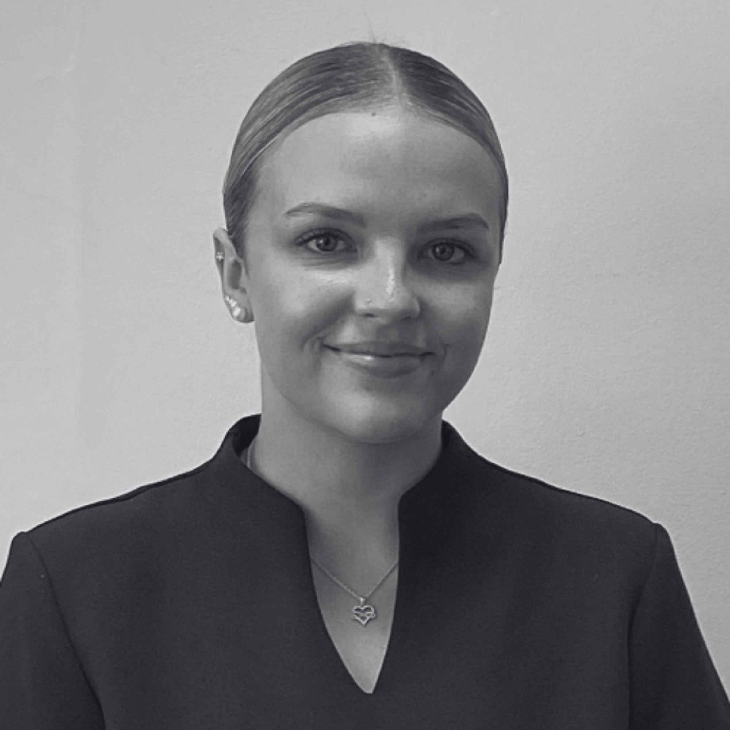 Black and white portrait of a woman with a neutral background