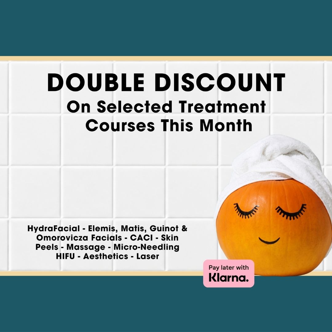 Promotional graphic with the text 'DOUBLE DISCOUNT On Selected Treatment Courses This Month' over a white tiled background, with a smiling orange face wrapped in a white towel and a Klarna payment badge.