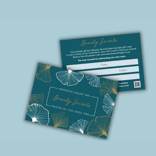 A Beauty Secrets gift card in front of a blue background